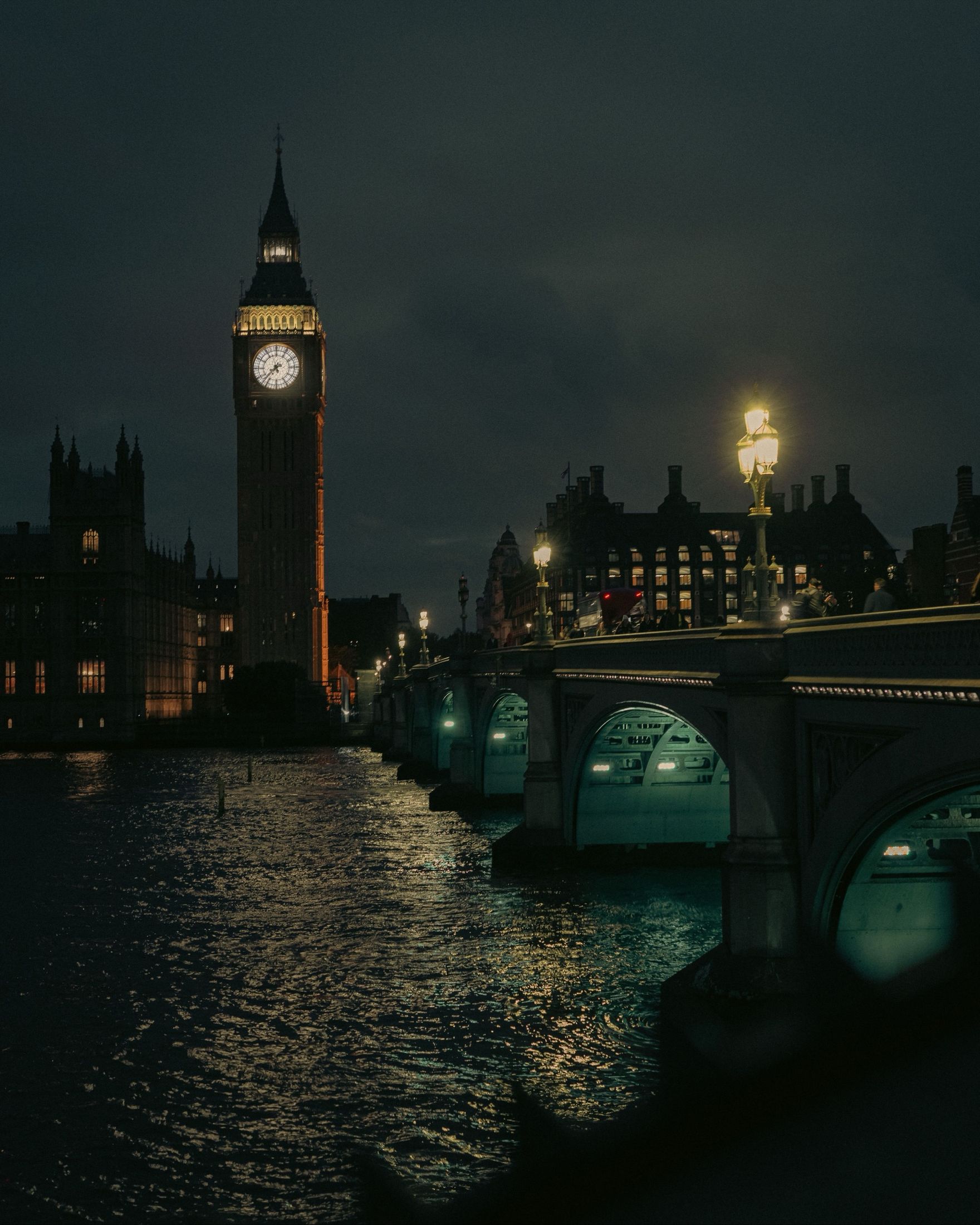 The City of London skyline at night, seen across the river