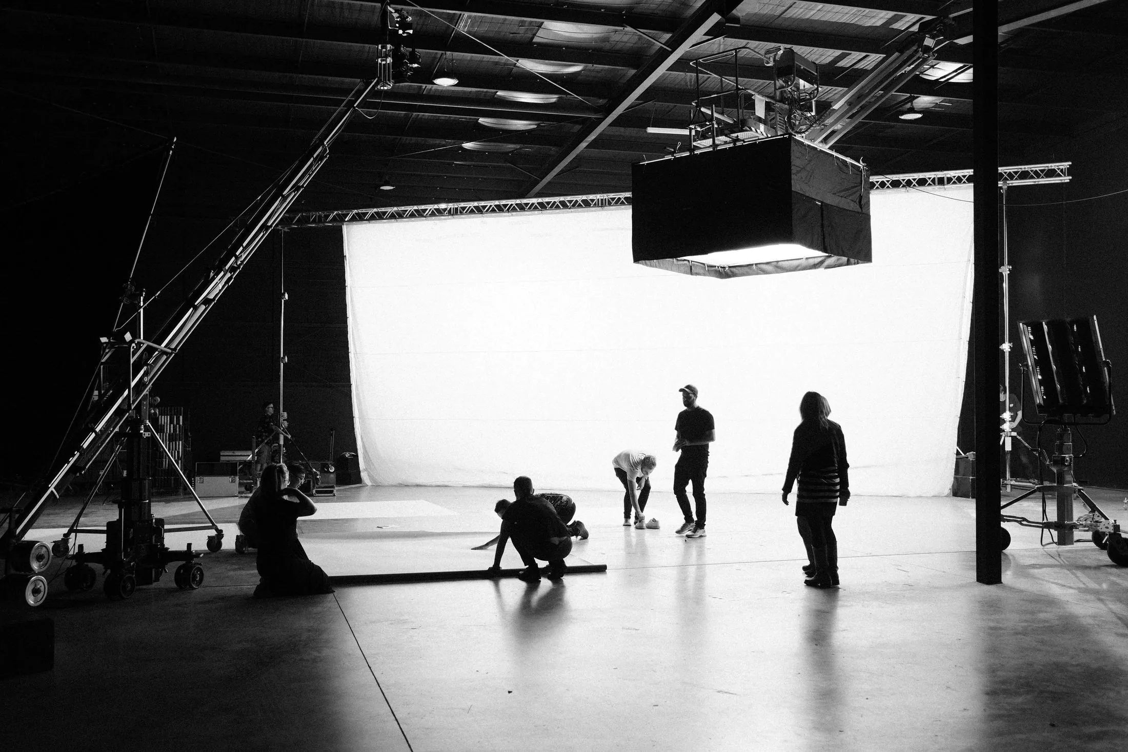 A film crew working on a studio sound stage